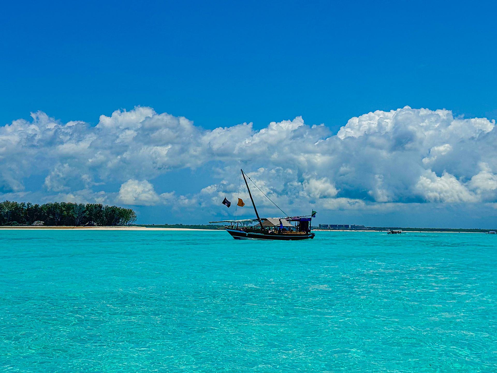 Dhow on turquoise ocean at Kiwengwa, Zanzibar